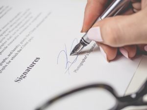 signing your signature to buy a business