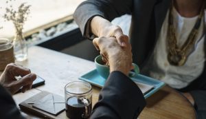 handshake over business with absentee owner